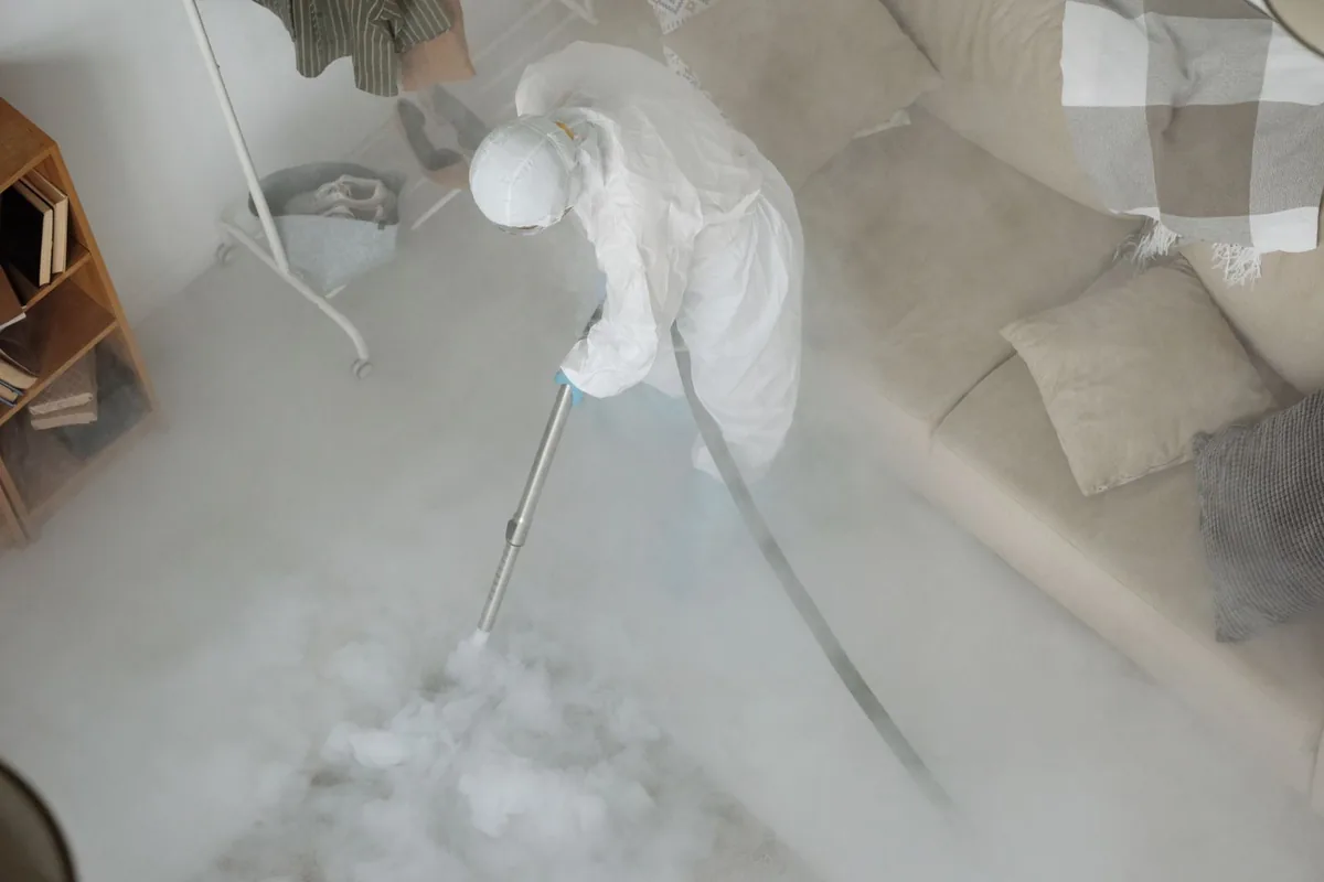 Biohazard cleanup technician in protective equipment, Maynard, MA
